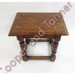 An oak joint stool the rectangular top on baluster turned supports and plain stretchers 45.5cms