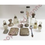 A silver cigarette case; another silver cigarette case; four glass toilet bottles with silver