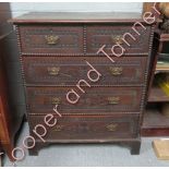 A 19th Century oak chest of two short and three long drawers, the drawers with carved decoration and