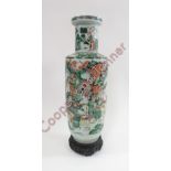 A Chinese vase decorated with various figures riding horses, 59cm high