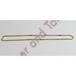 A chain, of round facetted belcher links with trombone links at intervals, tagged '9ct', 46 cm long,