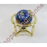 A small modern hardstone and abalone terrestrial globe, gimble mounted in brass stand, approx. 23cms