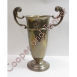A silver two handled trophy cup, by Elkington & Co, Birmingham 1927, of vase shape, with scroll