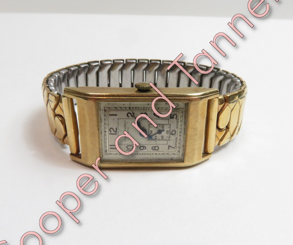 H&R Marsh, Bath, a gentleman's 9 carat gold wrist watch, the rectangular signed dial with black