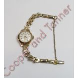 H&G, a 9 carat gold lady's mechanical wrist watch, on a plated bracelet