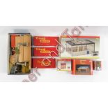 A quantity of OO gauge lineside accessories, track, buildings, boxed and unboxed also includes