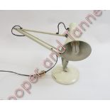 An angle poise lamp in cream painted metal