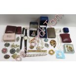 A small quantity of costume jewellery and three fashion watches, one cased, also a small number of