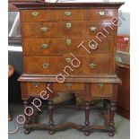 An early 18th Century walnut chest on stand the upper section fitted with three short and three