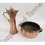 A WMF Art Nouveau copper wine jug with brass handle and embossed decoration 39cms high together with