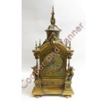 A French late 19th century brass inlaid enamel mantel clock, with brass cherubs above the arch and