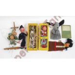 A Pelham Dutch Girl puppet in original box with label; a skeleton puppet in box for Gepetto; an