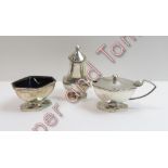 A silver three piece cruet set, maker TS, Birmingham 1934, of elongated hexagonal outline, on a