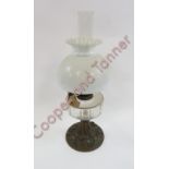 A late 19th/early 20th Century oil lamp with white glass shade, Duplex burner, faceted glass