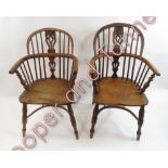 A near pair of late 19th Century Windsor chairs having pierced splats, curved yew wood top rail