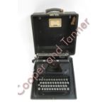 An Everest manual typewriter “Mod 90” with qwerty keyboard and in original carrying case