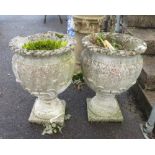 MATCHING PAIR OF RECONSTITUTED STONE URNS