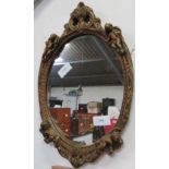 GILT FRAMED WALL MIRROR DECORATED WITH CHERUBS