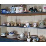 3 SHELVES OF CHINA INCLUDING POOLE POTTERY DOLPHINS, CORONATION WARE, BLUE & WHITE PATTERN ETC