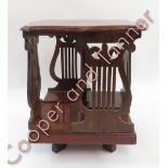 A Globe Wernicke mahogany table top revolving bookstand with lyre sides, 38cms high, labelled