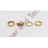 A 22 carat gold wedding ring; with another two 22 carat gold wedding rings; 7.9 g gross; and a 15