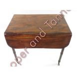 A Victorian mahogany Pembroke table fitted with single drawer and dummy drawer and on tapering