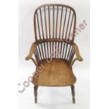 A late 19th Century stick back Windsor farmhouse kitchen chair with turned supports and stretchers