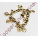 A 9 carat gold bracelet, of solid filed curb links, with various charms attached, 34 g gross