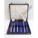 A set of three silver handled fruit knives and forks in later case