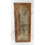 An Indian teak door with decorative moulded panel to one side, traces of original paint and metal