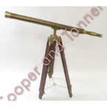 A reproduction telescope on tripod stand, having brass barrel, 6.5cms diam