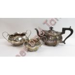 A silver three piece tea service, by Joseph Gloster Ltd, Birmingham 1921, of oval lobed outline,