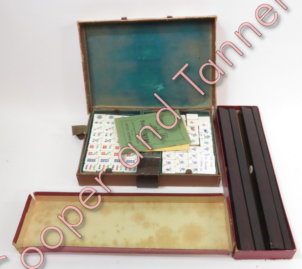 Mah Jong - a case of tiles and counters with booklets of rules and a box of Mah Jong wings