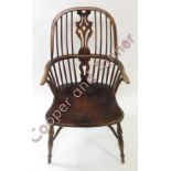 A reproduction Windsor chair having ash back, pierced splat, elm seat and crinoline stretcher