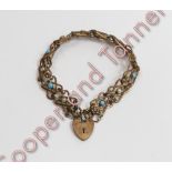 An Edwardian base metal bracelet, the fancy links alternate set with simulated pearls and