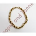 A French gold bracelet, of hollow links, with French eagle head control mark, 14.6 g gross