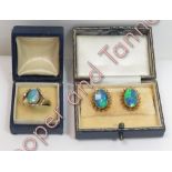 A pair of opal doublet earclips, stamped '9ct', 4.5 g gross, cased; with an opal doublet metal ring