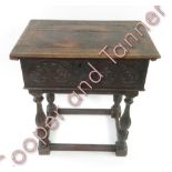 An 18th Century carved oak Bible box on stand with original lock plate, 73cms high 65.5cms wide