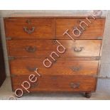 A 19th Century polished teak military chest of two short and three long drawers, in two sections and