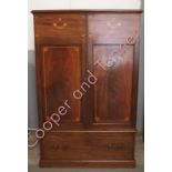 An inlaid mahogany cabinet with large base drawer, the interior converted for TV, 169.5cms high