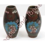 A pair of miniature Japanese cloisonné ovoid vases with floral decoration on a black ground, 6.