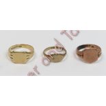 A 9 carat gold signet ring; with another two 9 carat gold signet rings; 10.8 g gross