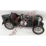 A large modern painted metal model of an early MG racing car painted “2” to the sides 128cms long