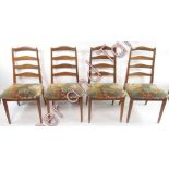 A set of four G Plan dining chairs with ladder backs and upholstered seats