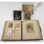 A late Victorian leather bound photograph album containing contemporary photographic portraits of