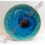 A large Arabia Finland studio circular pottery plate, having crackled turquoise glaze, incised marks