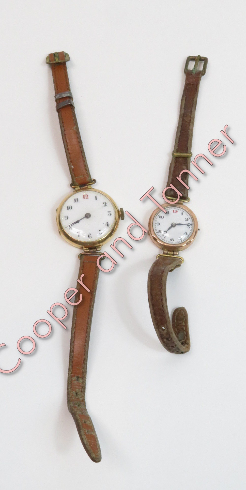 A 15 carat gold lady's mechanical wrist watch, on a strap; with a lady's 9 carat gold wrist watch on