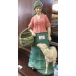 GARDEN STATUE OF A SHEPPERDESS WITH A SHEEP