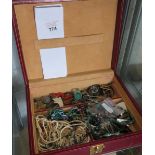 COLLECTION OF COSTUME JEWLLERY IN A RED LEATHER CASE