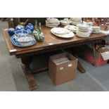 CARVED OAK EXTENDING DINING TABLE